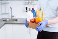 Courier in protective medical gloves delivers box with set food stock for quarantine isolation period. Online food store and Royalty Free Stock Photo