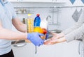 Courier in protective medical gloves delivers box with set food stock for quarantine isolation period. Online shopping and Royalty Free Stock Photo