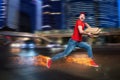 Courier runs fast to deliver quickly pizzas with fiery feet. Cyan background Royalty Free Stock Photo