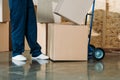 Courier stacking cardboard boxes