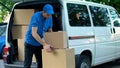 Courier Taking Boxes Out From Delivery Van, Moving Company, Goods Shipment