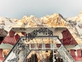 Structure of mirrors in the square of Courmayeur indicating the arrival in the village with the background of the snowy mountains