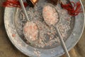 Course pink Himalayan salt on pewter plate and pewter spoons