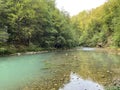 The course of the river Kupa directly below the mountain karst spring - Razloge, Croatia /Tok rijeke Kupe kod izvora Royalty Free Stock Photo