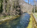 The course of the river Orbe between the cave or spring and the settlement of Vallorbe der Fluss Orbe or le fleuve de l`Orbe Royalty Free Stock Photo