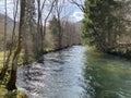 The course of the river Orbe between the cave or spring and the settlement of Vallorbe der Fluss Orbe or le fleuve de l`Orbe Royalty Free Stock Photo