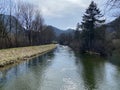 The course of the river Orbe between the cave or spring and the settlement of Vallorbe der Fluss Orbe or le fleuve de l`Orbe Royalty Free Stock Photo