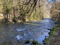 The course of the river Orbe between the cave or spring and the settlement of Vallorbe der Fluss Orbe or le fleuve de l`Orbe Royalty Free Stock Photo