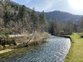 The course of the river Orbe between the cave or spring and the settlement of Vallorbe der Fluss Orbe or le fleuve de l`Orbe Royalty Free Stock Photo