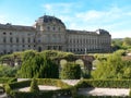 Court garden with water fontaine, stairs, hedges and geometrical beds