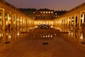 The court of Honor of the Palais-Royal with Les Spherades fountain by Pol Bury, the colonnade and, behind, the striped columns by Royalty Free Stock Photo