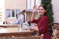 Busy courteous businesswoman calling waiter Royalty Free Stock Photo
