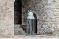 Armenia, Tatev, September 2022. Old green bronze bell in the monastery.