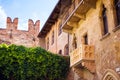 Courtyard of Casa di Giulietta House of Juliet with famous balcony of Juliet from drama William Shakespeare Romeo and Juliet in Royalty Free Stock Photo