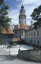 A courtyard of the Castle of Cesky Krumlow, with the round painted tower which has become the symbol of the town. Cesky Krumlov is