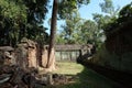 The courtyard of the dilapidated temple complex in Indochina. Ancient ruins in the forest Royalty Free Stock Photo