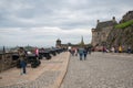 Courtyard Edinburgh castle with visitors and medieval cannons Royalty Free Stock Photo