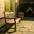 Courtyard featuring a wooden bench on a stone-paved surface. The Royalty Free Stock Photo