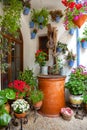 Courtyard with Flowers decorated and Old Well - Cordoba Patio Fe Royalty Free Stock Photo