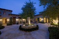 Courtyard With Fountain At Dusk Royalty Free Stock Photo