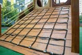 A courtyard of high-rise buildings with a modern and large playground made of wood and plastic on a rainy summer day without Royalty Free Stock Photo