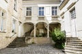 Courtyard and house porch with spiral staircases. Rue Haute Saint-Maurice, Chinon, France Royalty Free Stock Photo