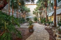 Courtyard with lights and tables at the Hampton Inn in New Smyrna Beach, Florida at sunrise