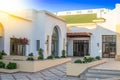 Courtyard of a luxury mansion. Tropical resort of high class. Sunshine and blue sky above the villa. Elysium dream for vacation