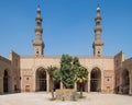 Courtyard of al Nasir Faraj ibn Barquq public historical mosque with two minarets, Cairo, Egypt