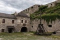 The courtyard of the medieval fortress with the idle old trebuchet. Royalty Free Stock Photo