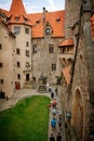 Courtyard of medieval majestic and romantic gothic castle Bouzov, old fairy-tale stronghold of Teutonic Order, fortress with stone Royalty Free Stock Photo