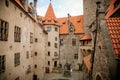 Courtyard of medieval majestic and romantic gothic castle Bouzov, old fairy-tale stronghold of Teutonic Order, fortress with stone Royalty Free Stock Photo