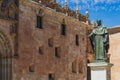 Courtyard of the minor schools of the University of the city of Salamanca and statue of Fray Luis de Leon, in Spain.