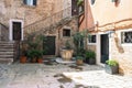 Courtyard of old italian town with flower pots and plant