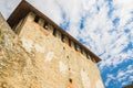 Courtyard and part of the wall of old castle Hotel near the river. Khotyn Fortress - medieval castle on yellow autumn hills.