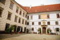Courtyard of Trebon Castle, Renaissance chateau, palace architecture and park with fountain, sunny summer day, historical medieval