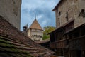 Courtyard view of distant turrets at Chillon Castle Montreux Switzerland Royalty Free Stock Photo