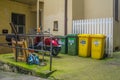 Courtyard with waste segregation and a scooter parked