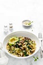 Couscous with avocado, spinach and sauteed champignon mushrooms with onion