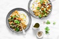 Couscous, chickpeas, vegetables salad with Greek yogurt on a light background. top view. Healthy food Royalty Free Stock Photo