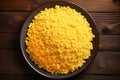 Couscous cornmeal porridge in a bowl on a wooden background