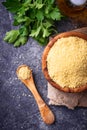 Couscous grain in wooden bowl