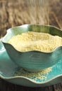 Couscous grains in bowl.