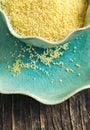 Couscous grains in bowl.