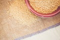 couscous grains in a brown porcelain bowl