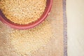 couscous grains in a brown porcelain bowl