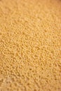 Couscous grains pile macro close up shallow depth of field top view