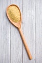 Couscous in wooden spoon