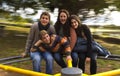 Cousins on a merry go round Royalty Free Stock Photo