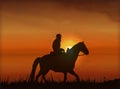 Covboj on horseback at sunset - vector